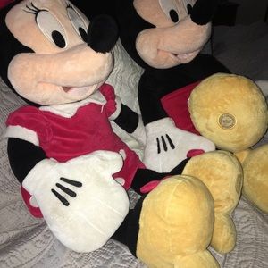 Mickey and Minnie Mouse Disney Brand stuffed animals.